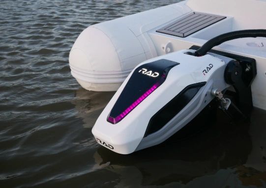 RAD electric outboard mounted on a boat on the water